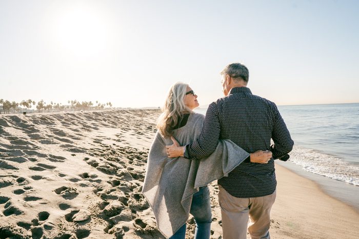 couple taking a romantic walk on the beach