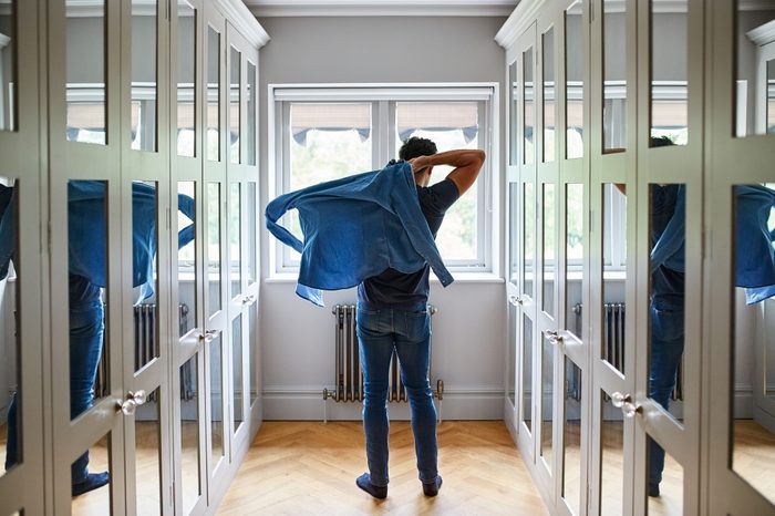 man getting dressed for a date or for work