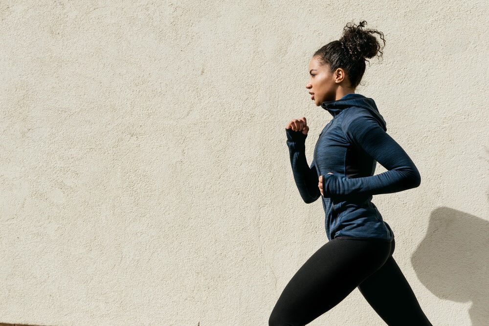 Cropped shot of a woman running in the city