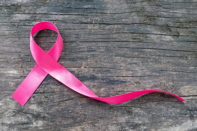 Pink ribbon breast cancer awareness symbolic bow color raising support on people living with women's breast tumor illness (bow isolated with clipping path)
