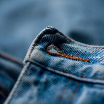 jeans button hole closeup fashion denim background