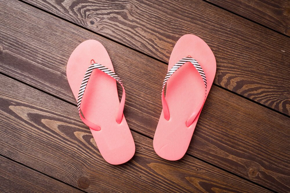 Flip flops on wooden table