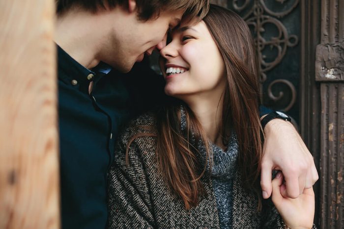 couple posing in the doorway posing on camera