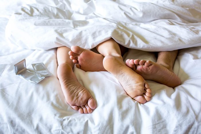 Foot man and girl be tired on the bed, couple bed story, many condom Beside.