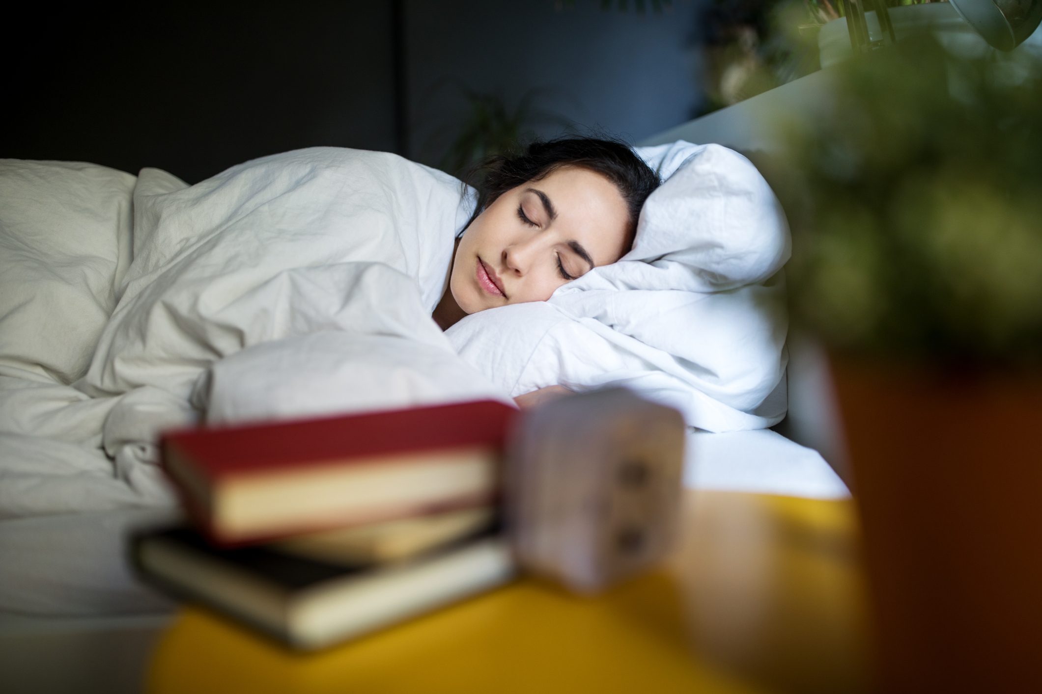 young woman sleeping in bed