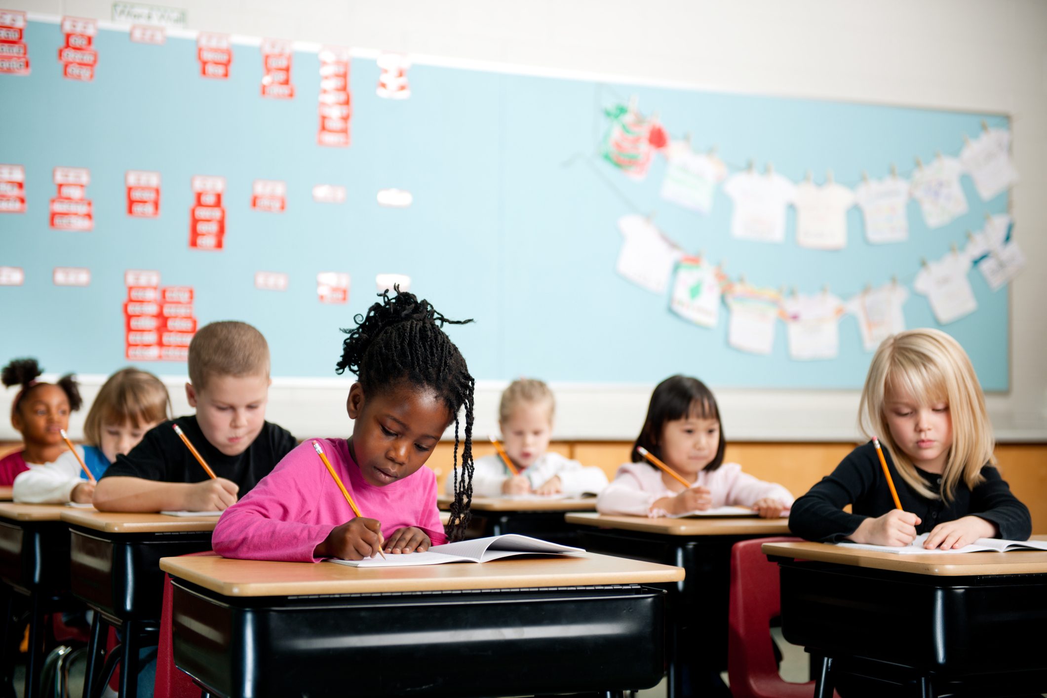 children in school working at desks