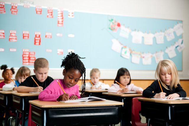 children in school working at desks