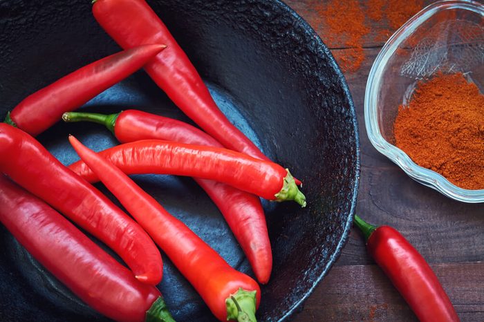 Raw red pepper in a frying pan