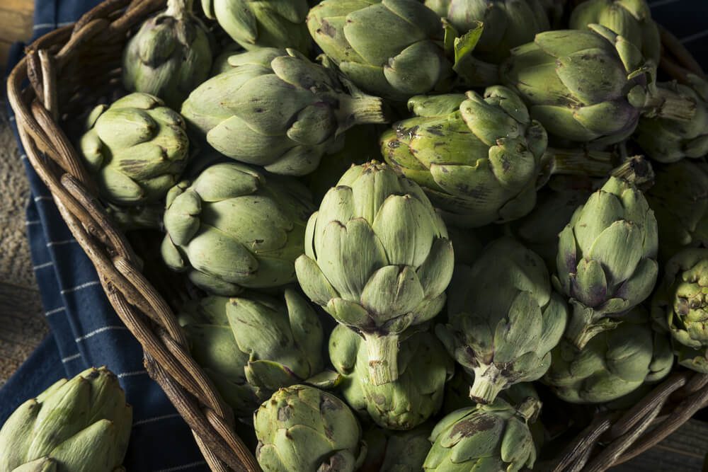 Healthy Raw Green Organic Baby Artichokes in a Basket
