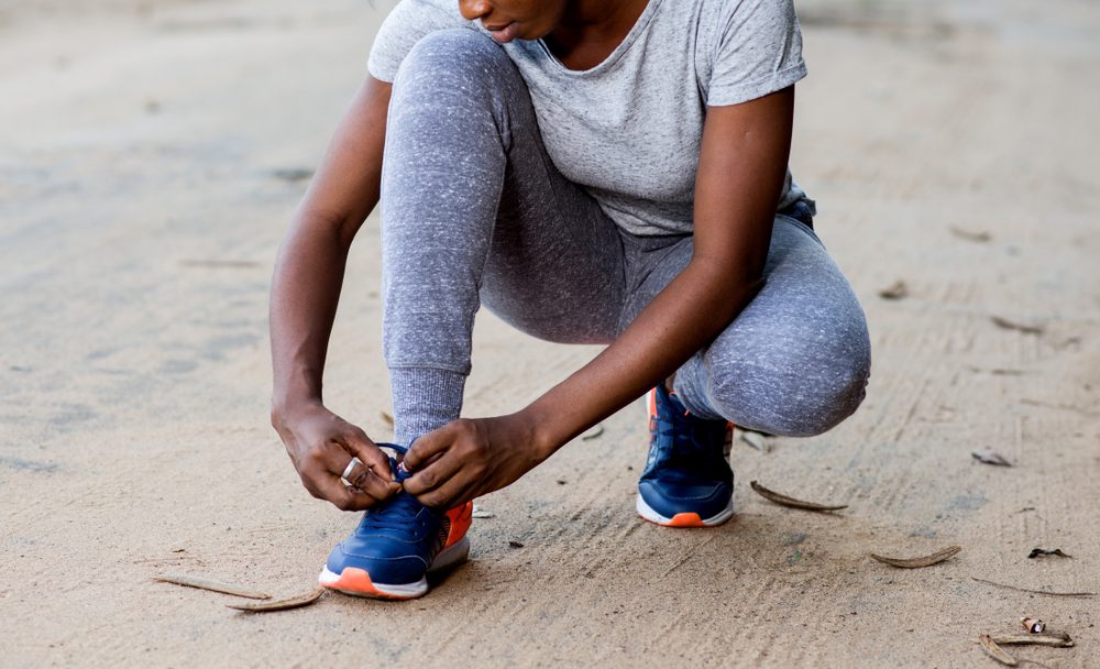 woman tying her shoes