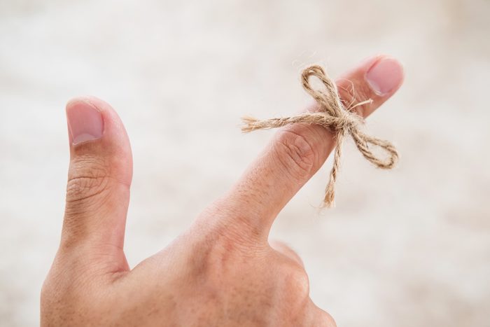 String tied around finger, selective focus