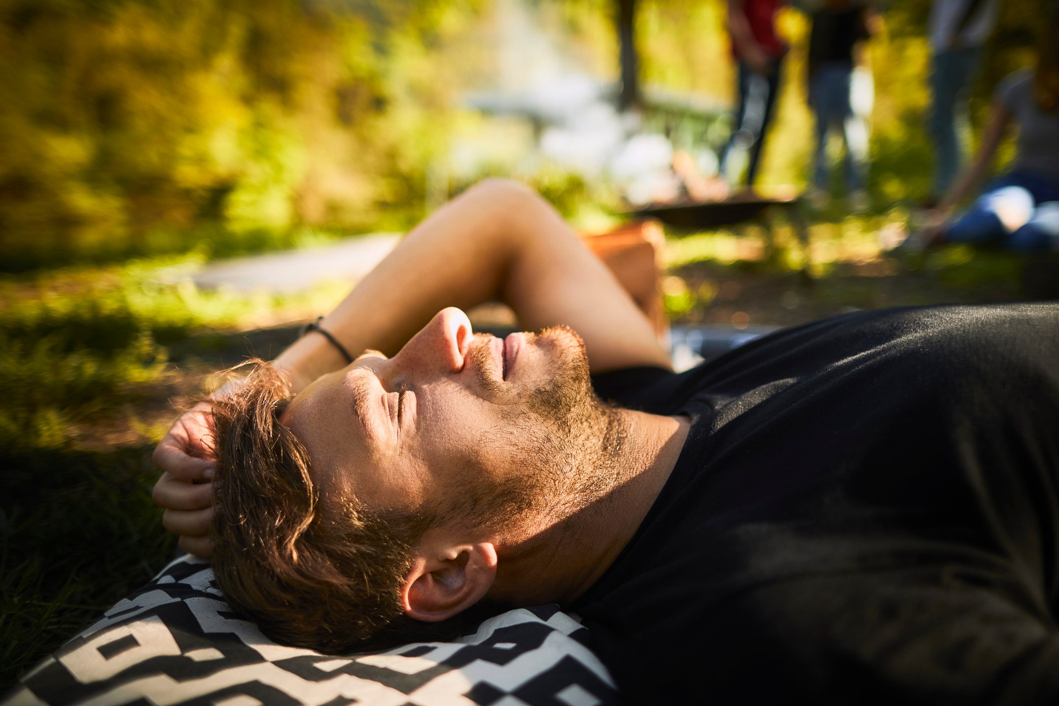 man laying down soaking up the sunshine
