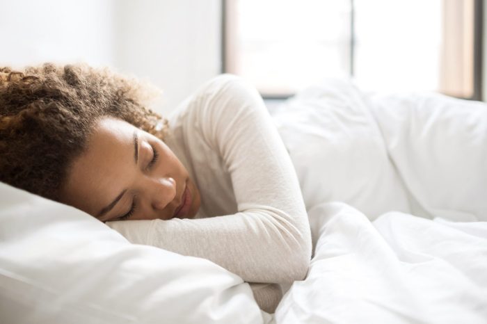 woman sleeping in bed morning