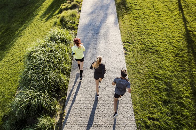 group of friends jogging outside