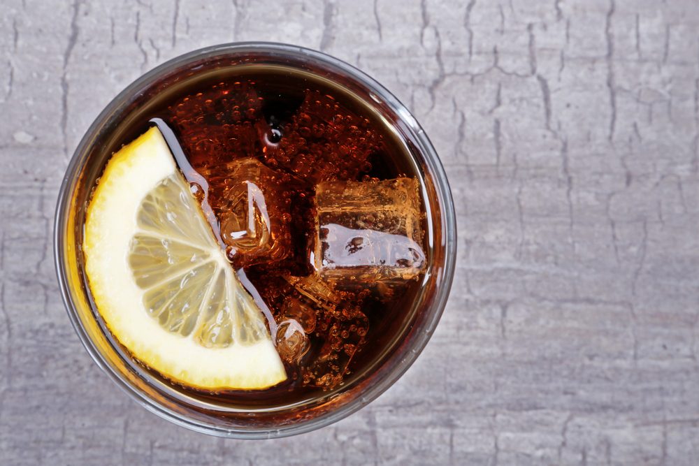 Glass of cola with ice and lemon