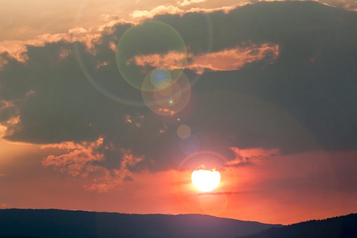 Red Sky Sunset from Forest Fire in Mountain Area