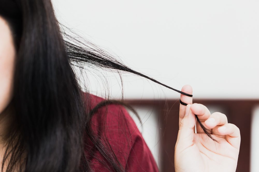 woman twirling or pulling strand of hair