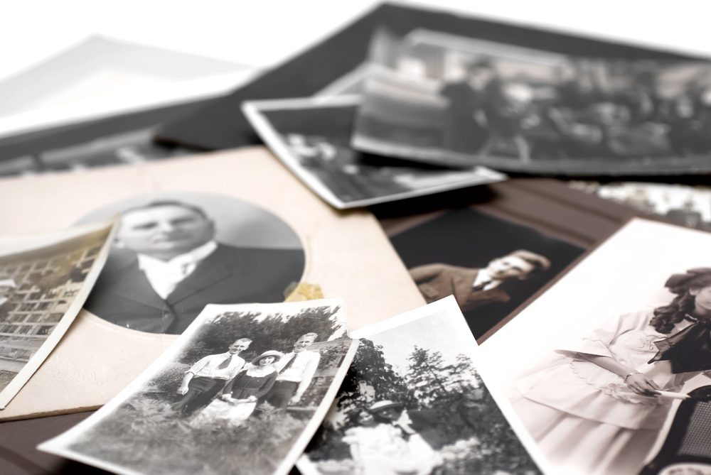 Closeup of a pile of vintage family photos