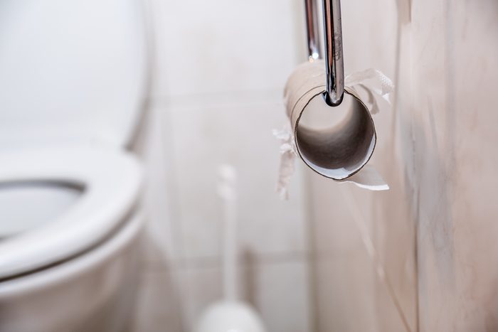 Close-up of finished toilet paper roll in bathroom