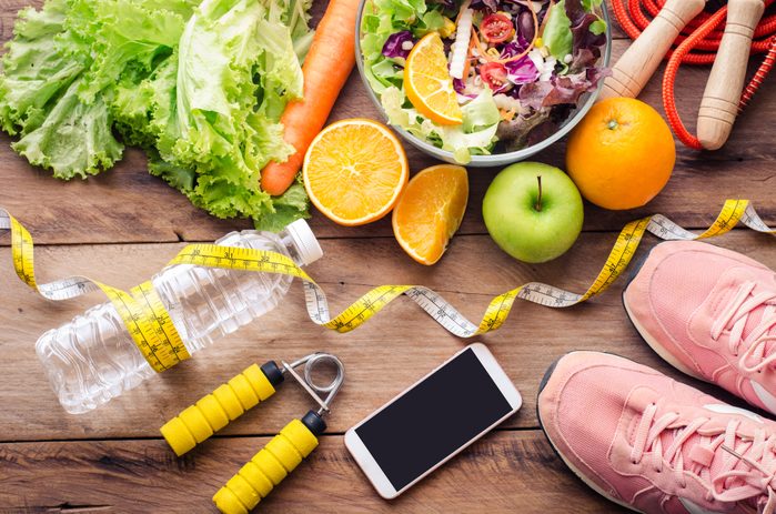 high angle view of diet and exercise accessories