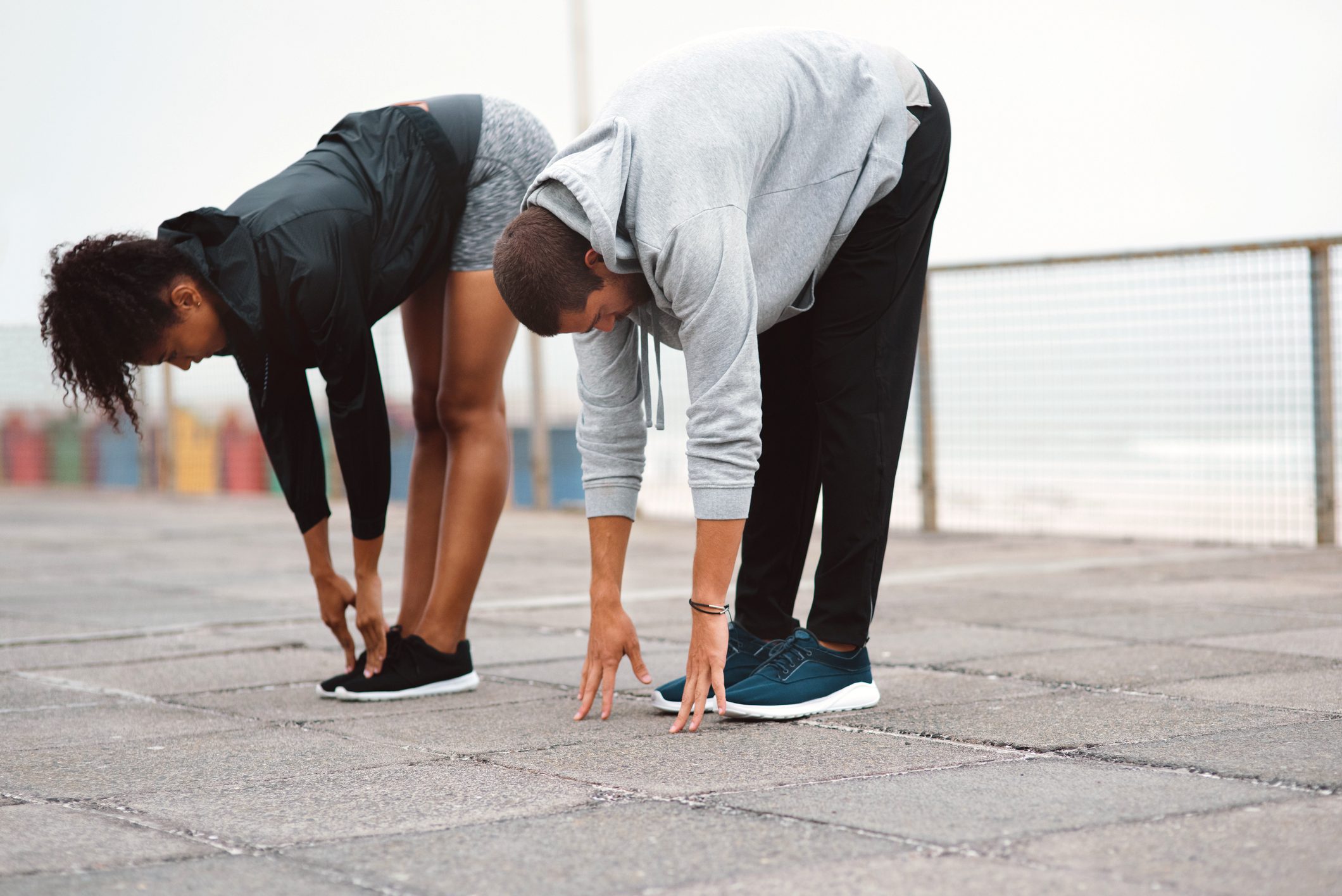 two people stretching