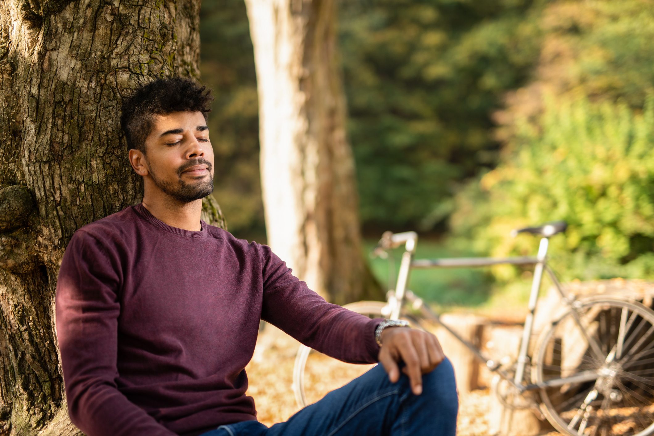 man sitting outside relaxing