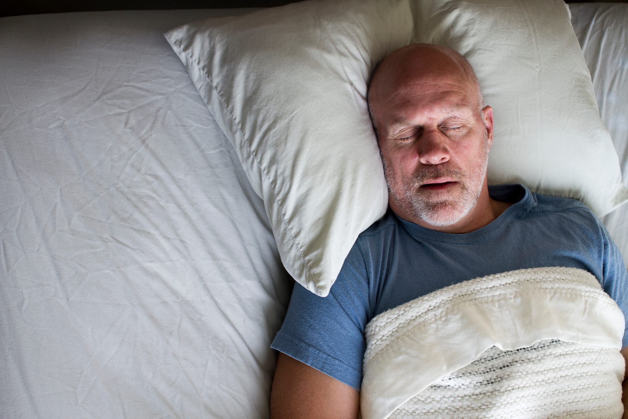 overhead photo of a man sleeping