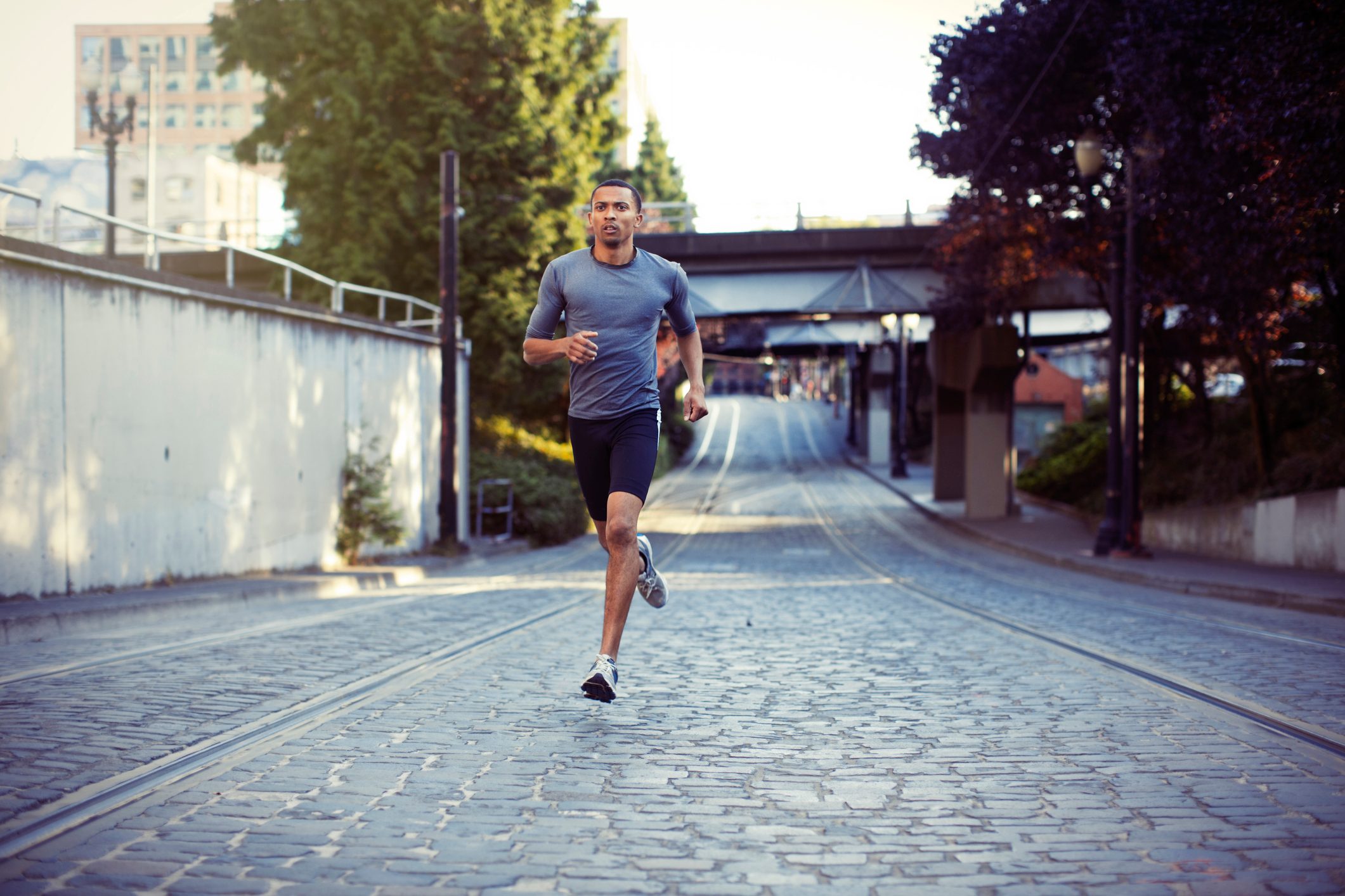 man running for exercise through the city