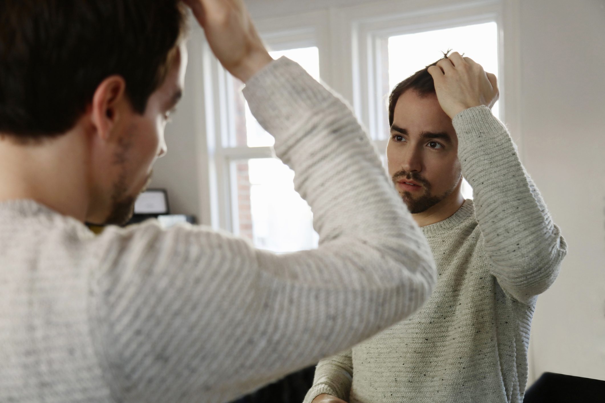 man looking in the mirror