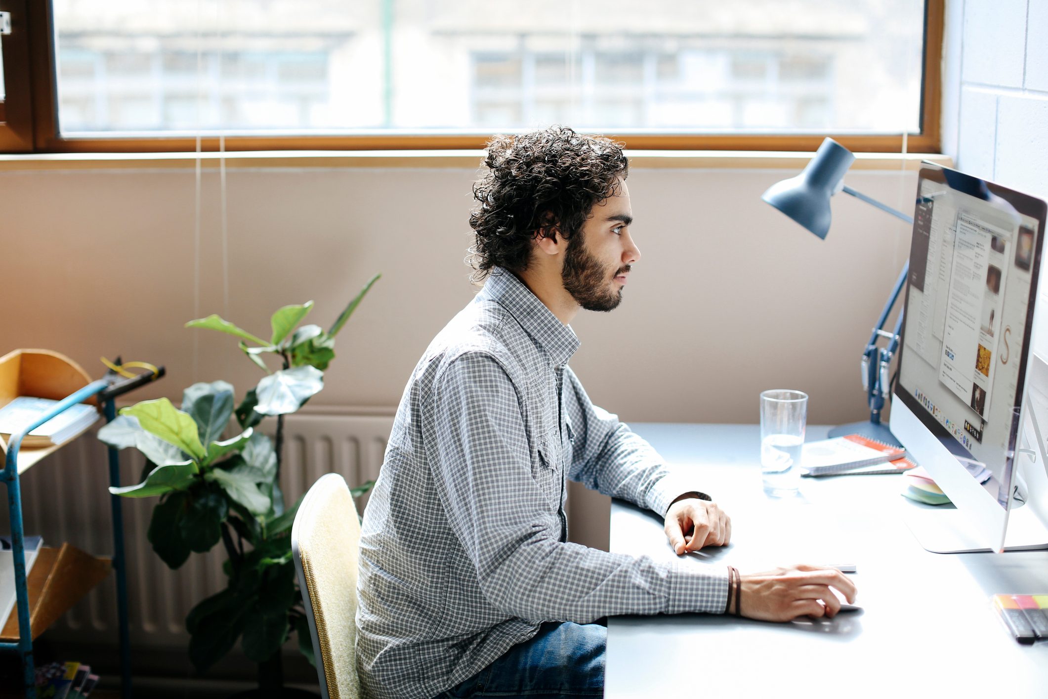 man sitting at desk working