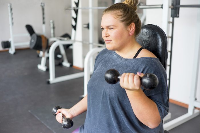 Overweight girl in a gym