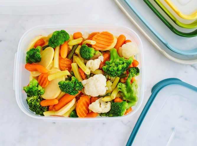 Frozen vegetables in container on counter.