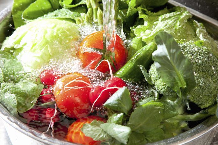A variety of vegetables to wash the sink