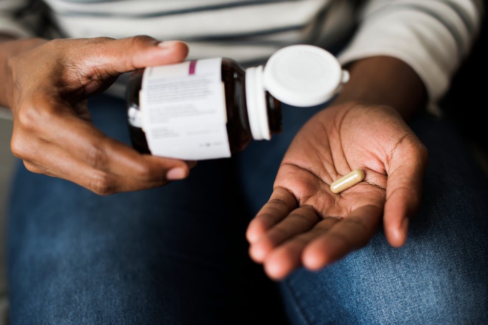 Woman taking pills for her health