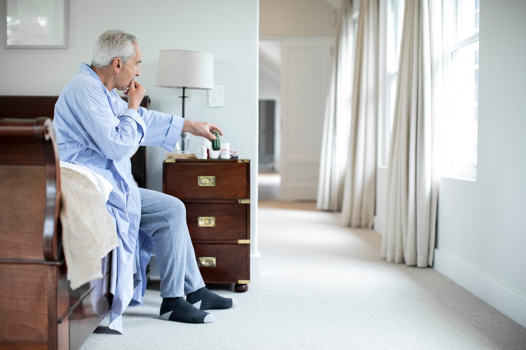 man taking pills in the morning