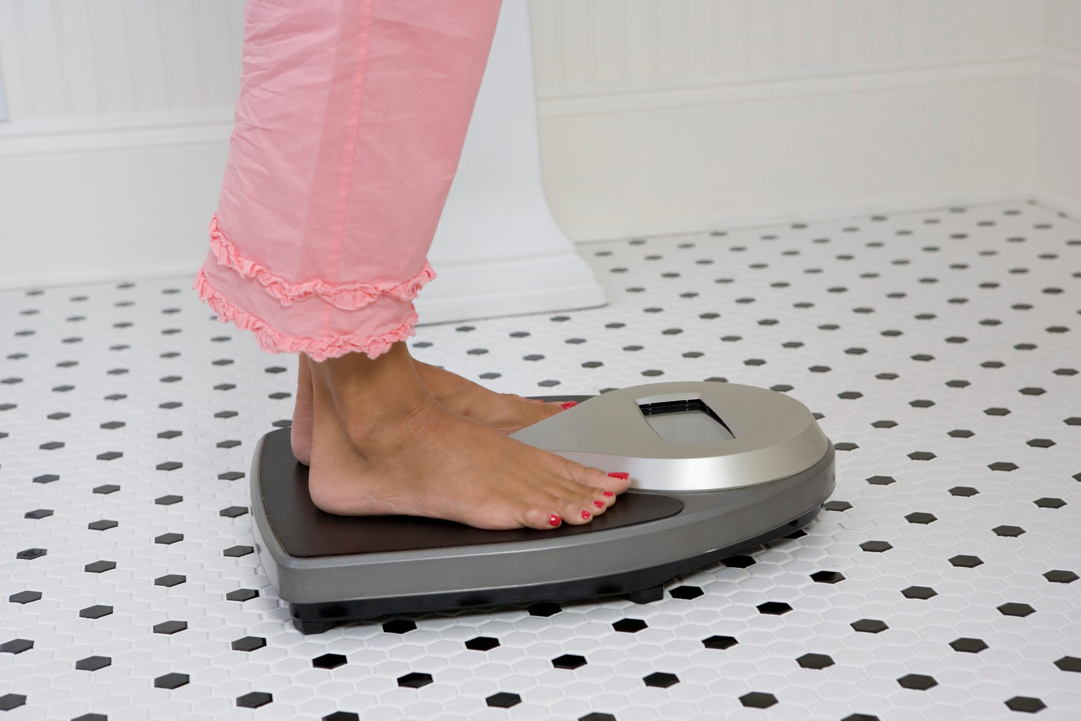 woman's feet on scale