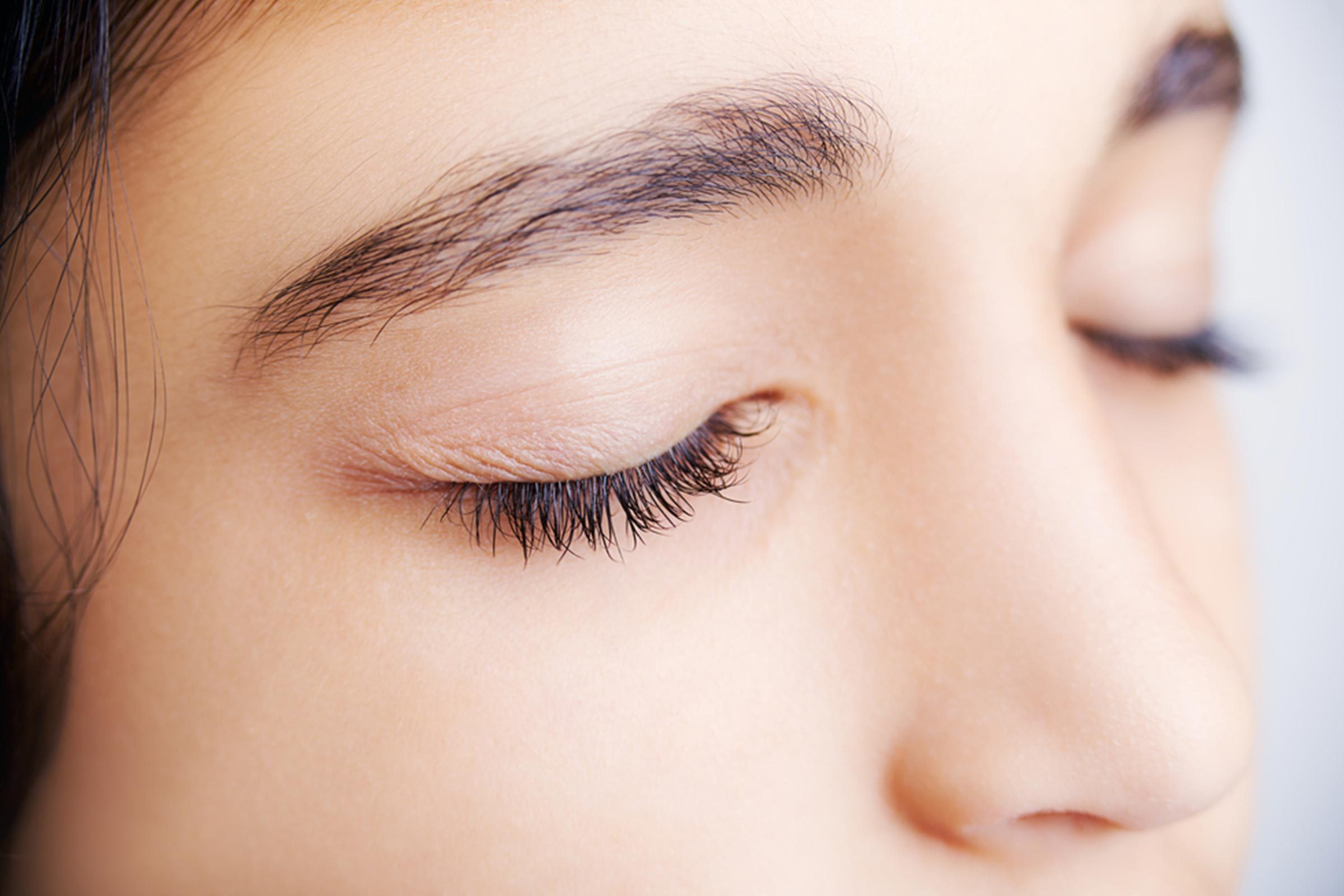 woman with eyes closed, eyelashes and eyelid