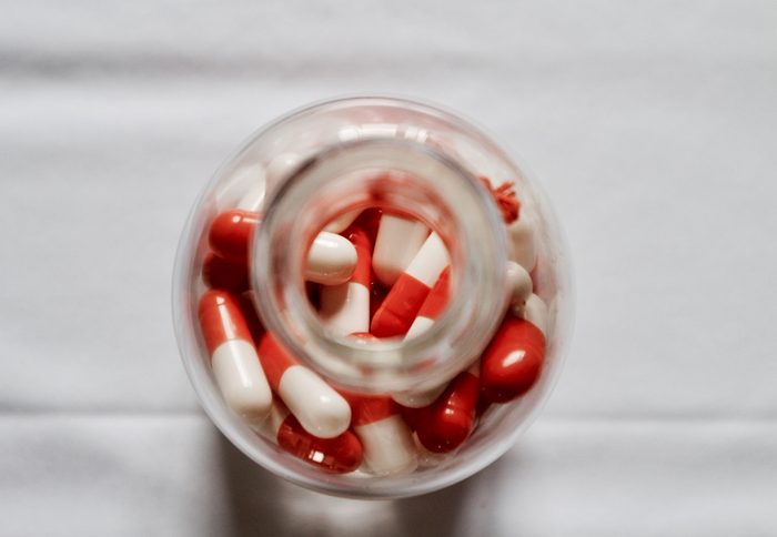 Medical healthcare, bottle of pills on white table