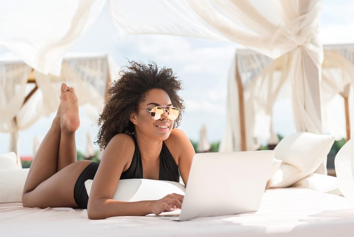 woman with laptop in summer