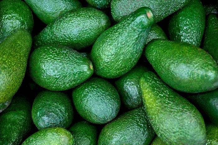 fresh avocado on the market. avocados are very nutritious and contain a wide variety of nutrients.