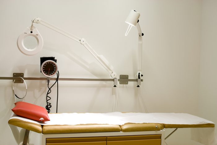 Medical examination table at doctor's office