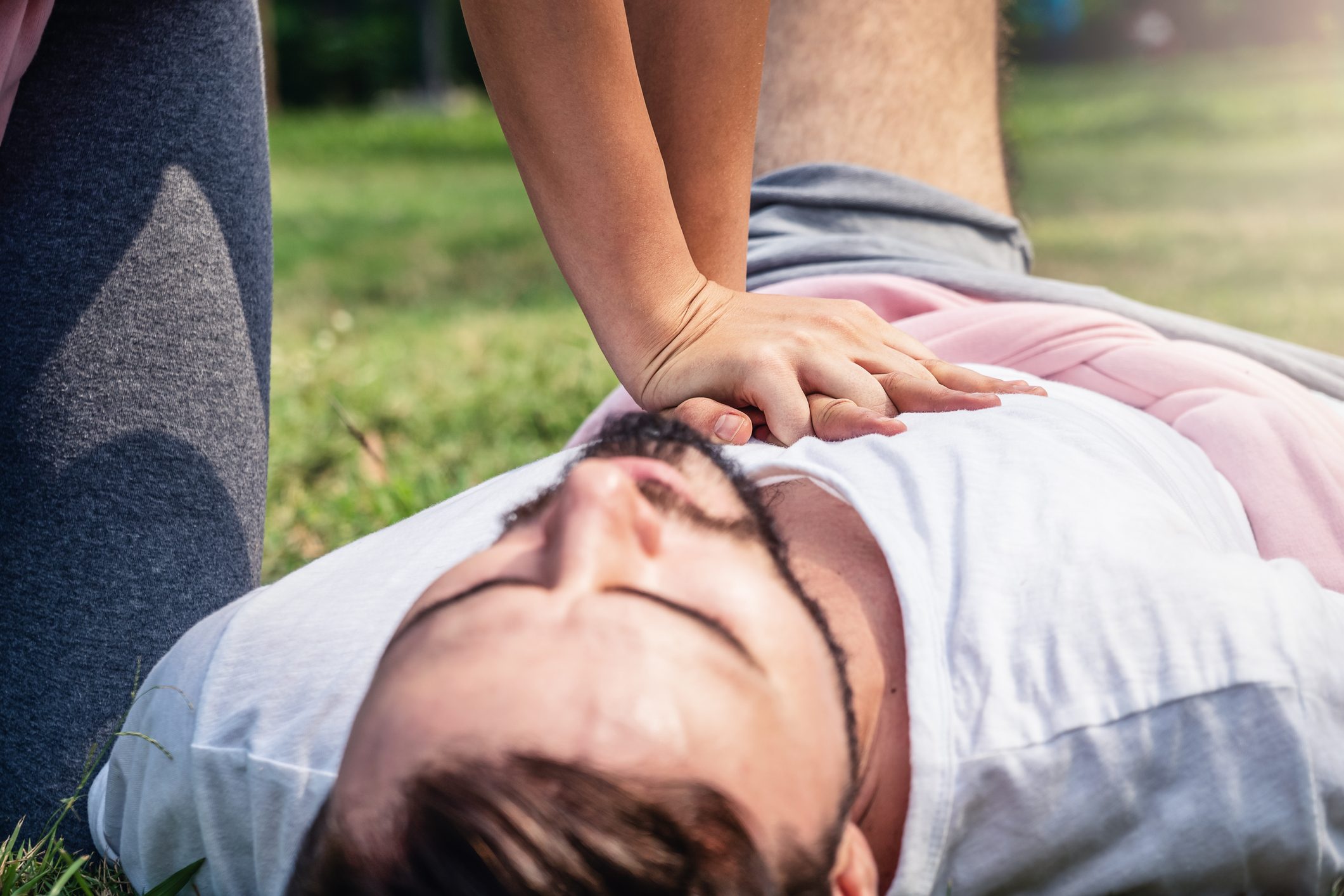 close up of woman giving man cpr