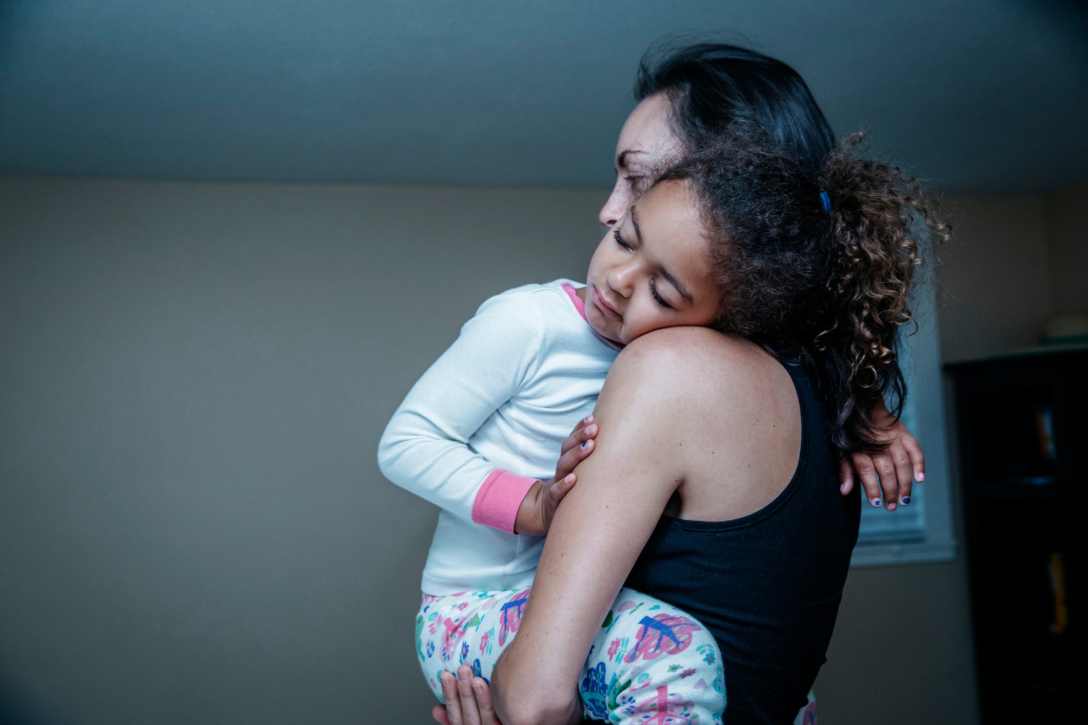 mother holding daughter