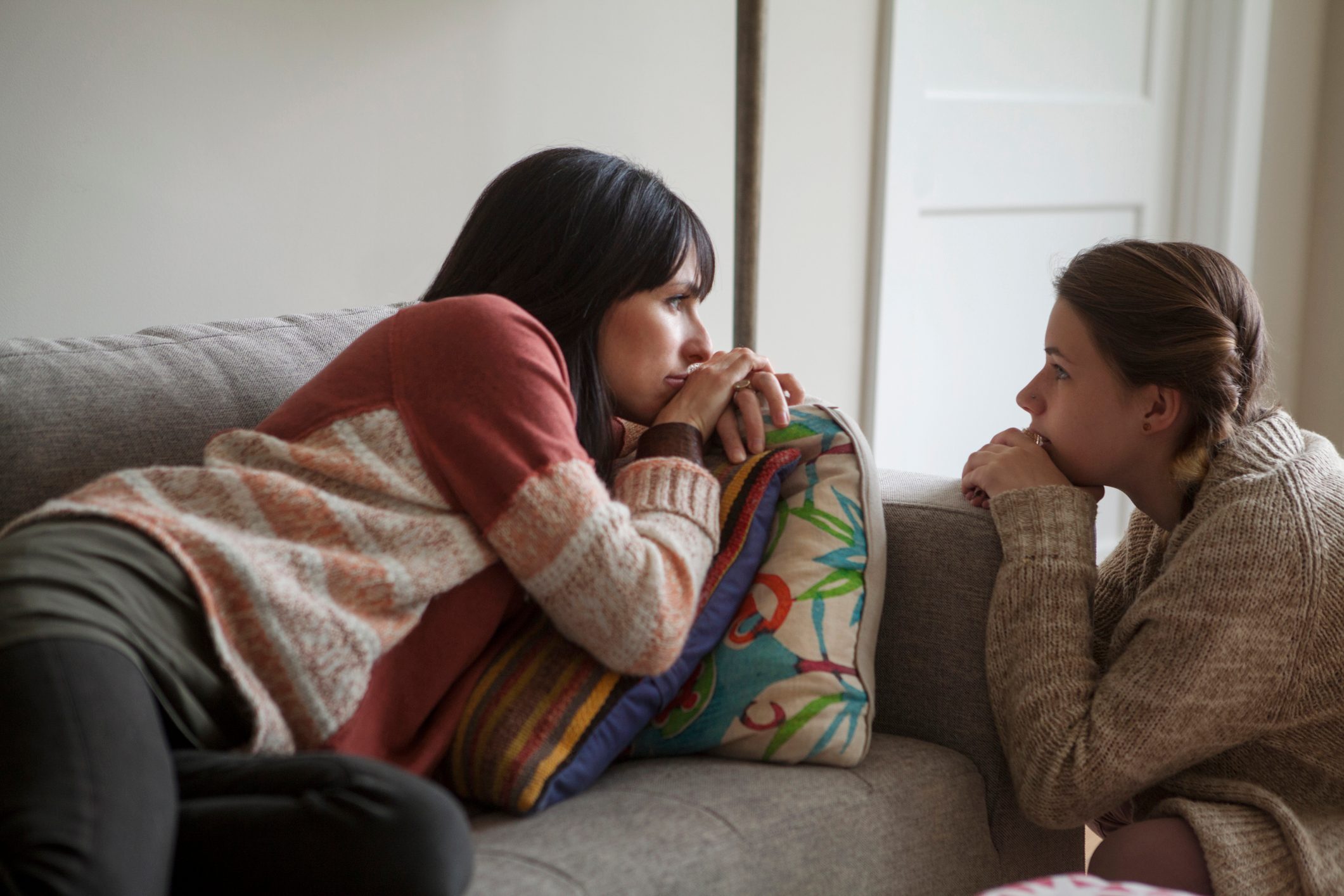 mother and daughter having a conversation at home