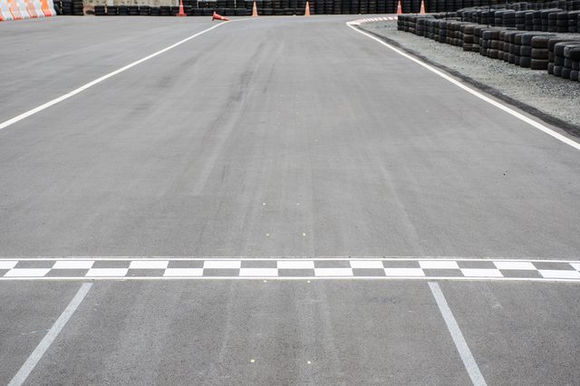 Start and Finish motor race line asphalt on Monaco Montecarlo Grand Prix street circuit