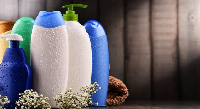 Plastic bottles of body care and beauty products.