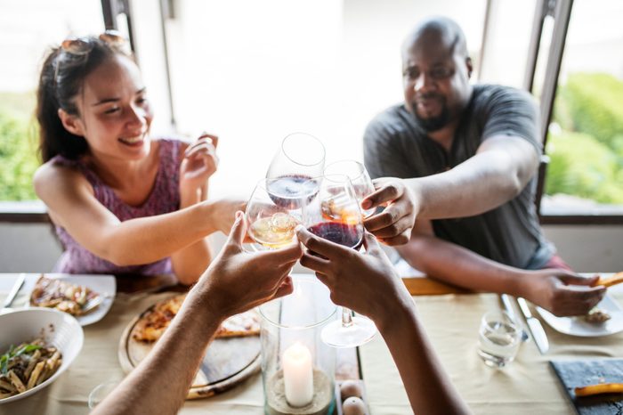 Friends drinking wine in a restaurant.