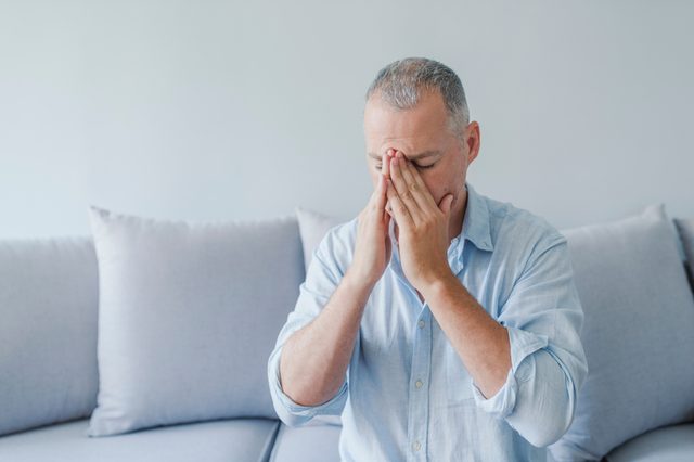 Brain diseases problem cause chronic severe headache migraine. Male adult look tired and stressed out depressed, having mental problem trouble, medical concept