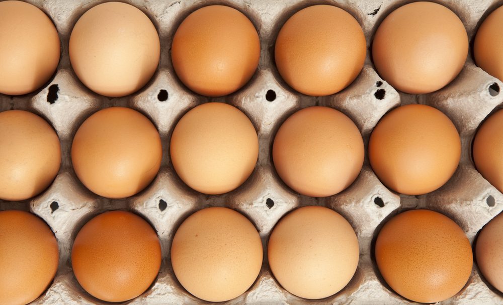 top view of organic eggs in a protective container