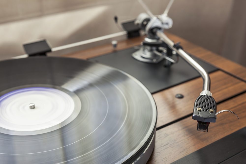 A vintage record player (turntable) with LP (record)